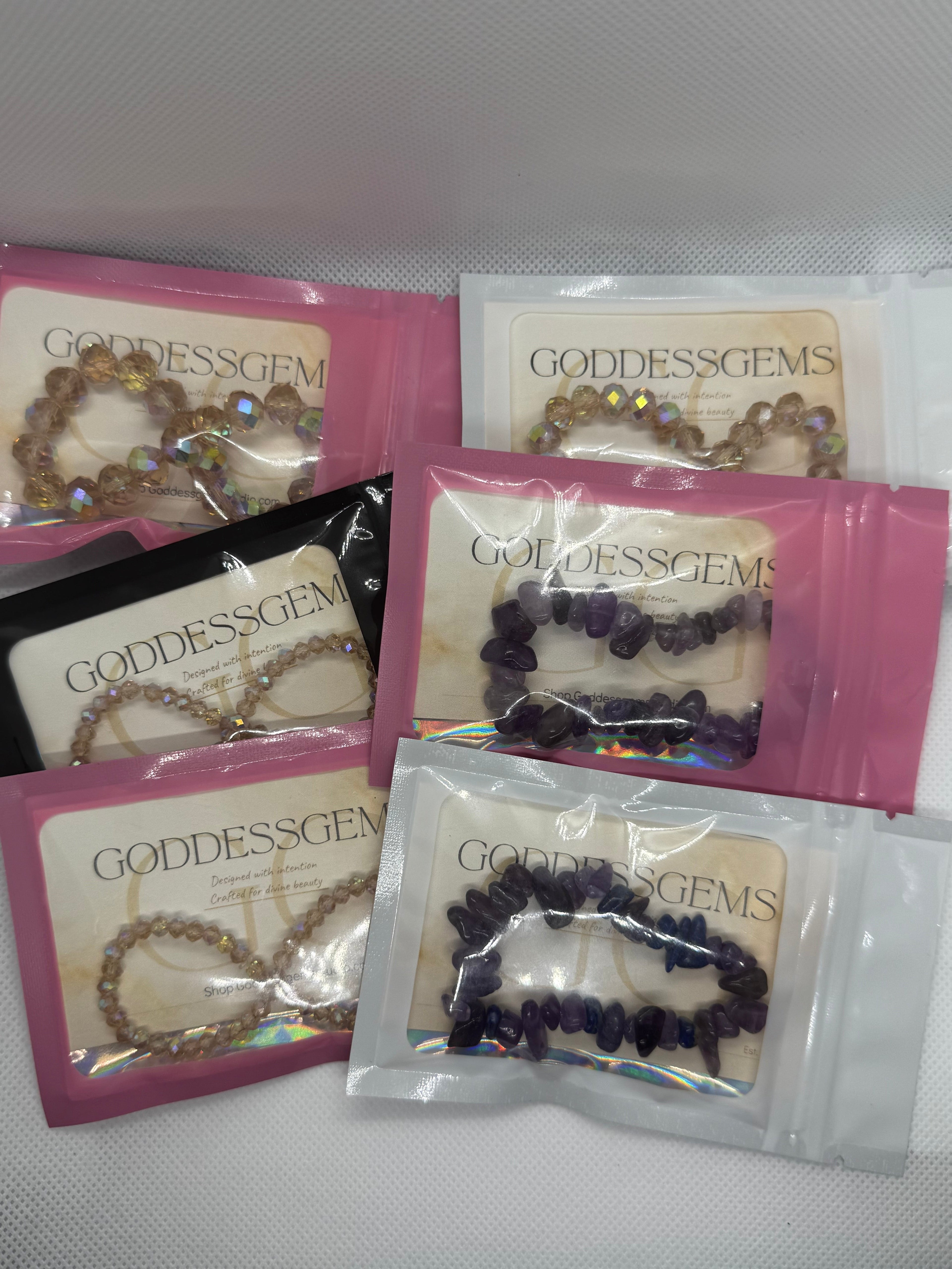 Goddess Gems jewelry packages on a white background